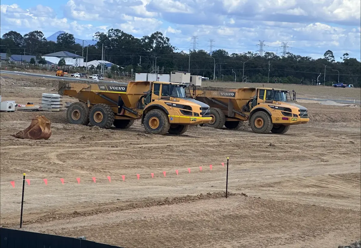 Dump trucks shaping new residential lots