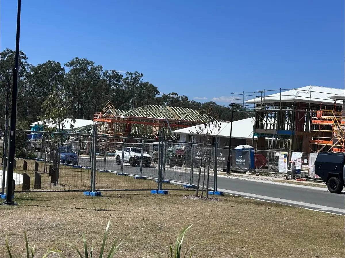 A street of new frames wrapped and roofed