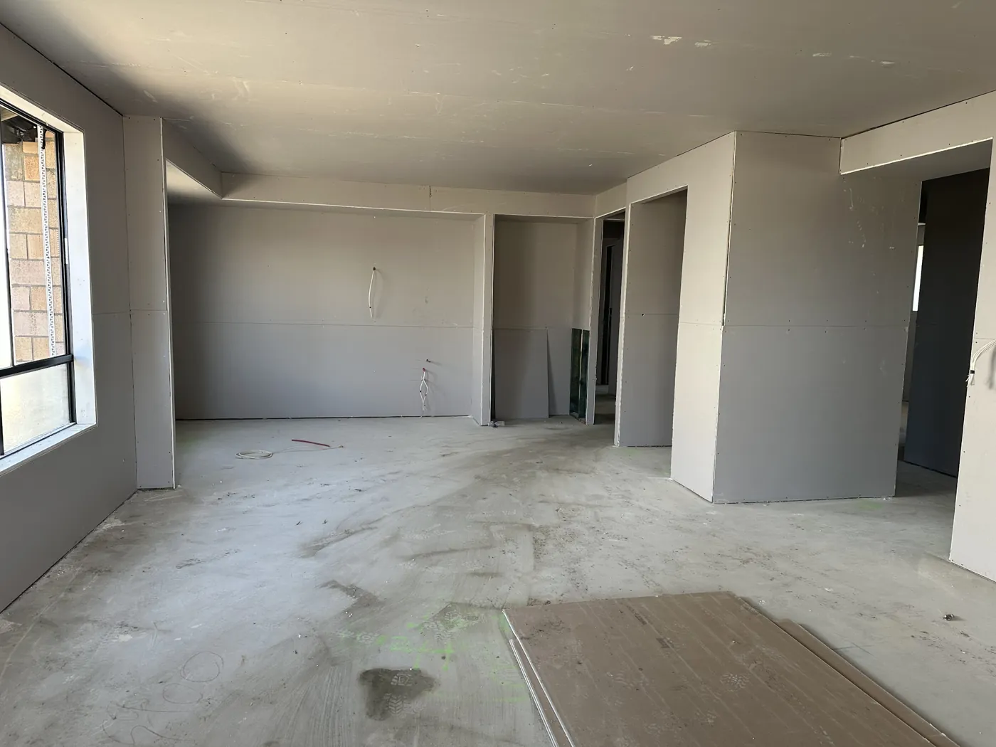 Plasterboard walls and ceiling in an unfinished living area
