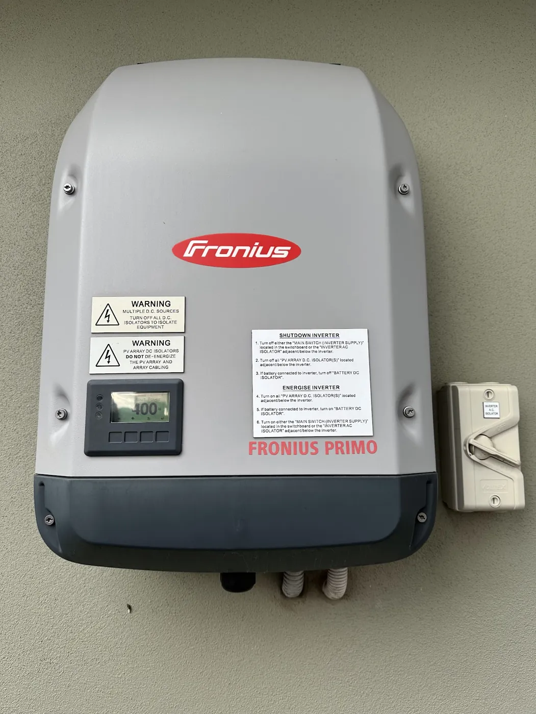A solar inverter mounted on an external wall